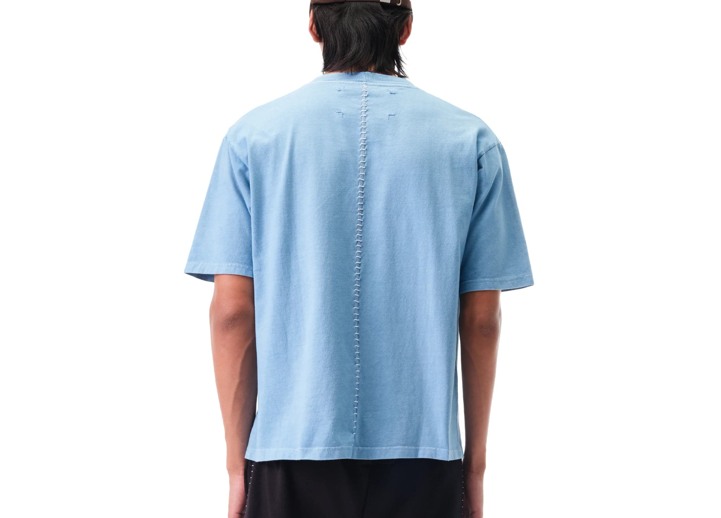 Model wearing the blue T-shirt, back